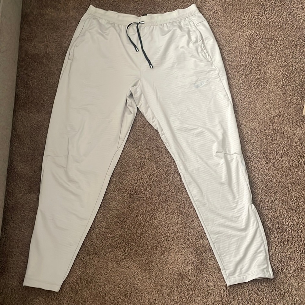 Men’s Nike Dri-Fit running joggers, light tan